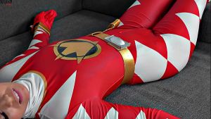 Hot brunette dominates over a Superhero girl