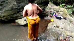 Old aunty was fucked in public while bathing in a pond in forest