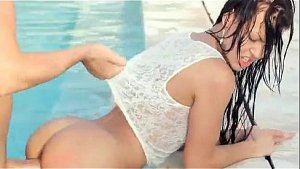 Pretty brunette doggy fucked in pool