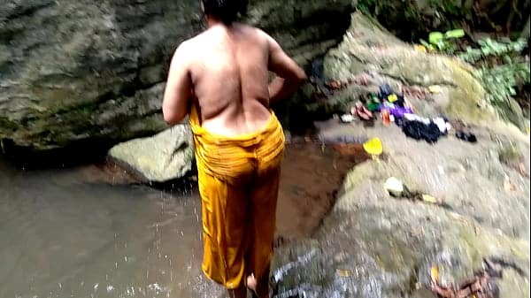 Old aunty was fucked in public while bathing in a pond in forest