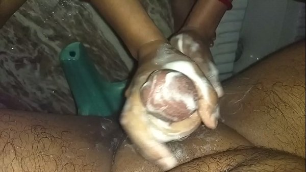 Sexy indian wife giving handjob to hubby while bathing