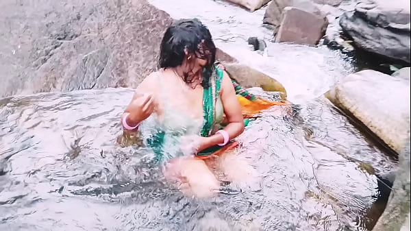 Villege aunty outdoor water fall bathing. Telugu dirty talks.