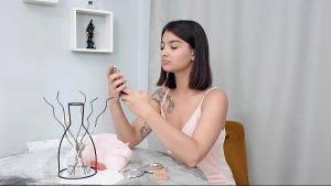 Dark-haired Sasha X-Ray puts on beautiful makeup and a sexy outfit